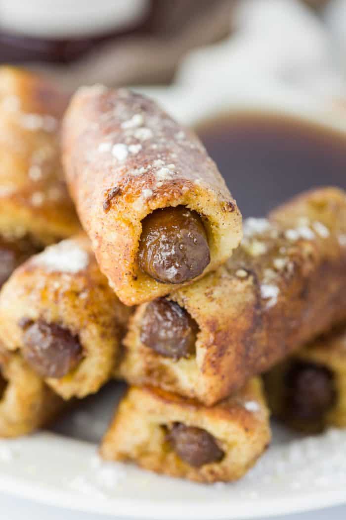 These French Toast Roll-ups with sausage are filled with warm, savory sausage that's in bread, dipped in a classic french toast mixture, and cooked to golden-brown perfection. | The Cozy Cook | #breakfast #brunch #frenchtoast #holidaybreakfast #sausage French Toast Sausage Roll-ups with Sausage