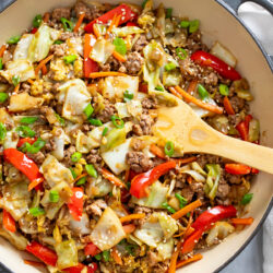 Cabbage Stir Fry with ground beef, pork, bell peppers, carrots, cabbage, and sauce.
